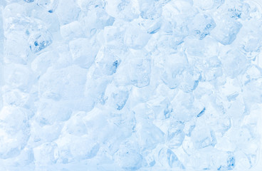 Ice cubes blue background.