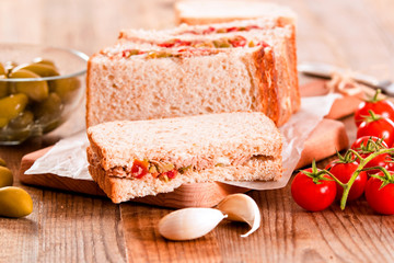 Tuna, olives and tomato sandwiches.