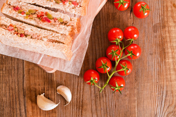 Tuna, olives and tomato sandwiches.