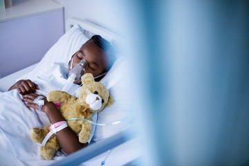 Patient wearing oxygen mask while sleeping