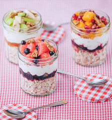 Oatmeal with fruit and cereals in a glass jar