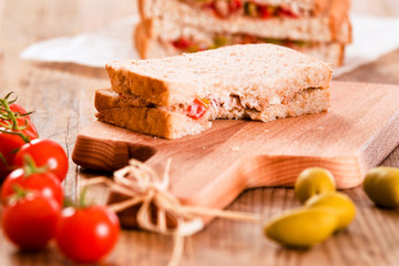 Tuna, olives and tomato sandwiches.