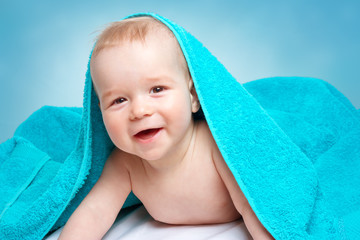 Cute baby in a towel