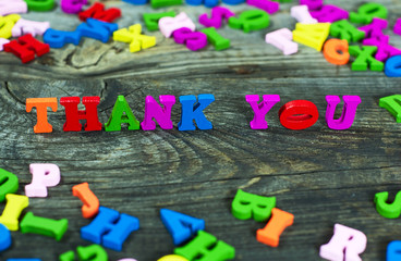 inscription thank you to you from the multicolored wooden small letters