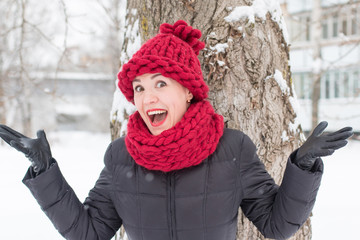 Cute girl in a warm hat in winter