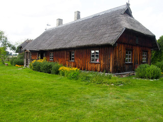 Fototapeta na wymiar Rustic Wooden Cottage in Latvia