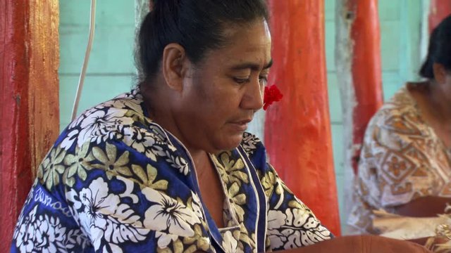 Samoan women weaving grass mats