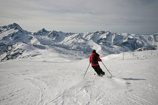 Girl enjoying a ski ride in the Alps