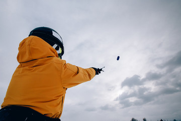 Fototapeta na wymiar Snowkiting. Male athlete skier snowboarder manages kite. Close-up. The Kola Peninsula.