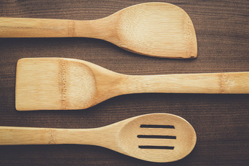 different wooden kitchen tools on the table
