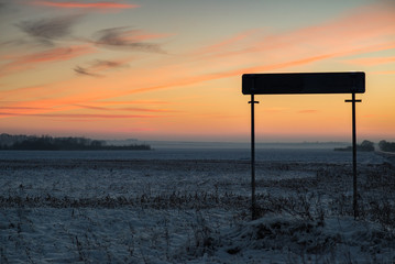 sign on the road in winter