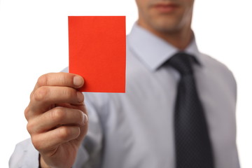 Businessman showing red card. Business and finance concept. Exclusion