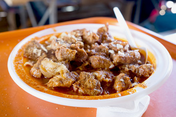 Holiday market in serbian village - beef goulash served with homemade pasta