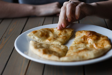 Traditional Georgian pie - khachapuri, is a cake baked in the oven with cheese