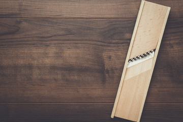 retro wooden shredder on the brown table