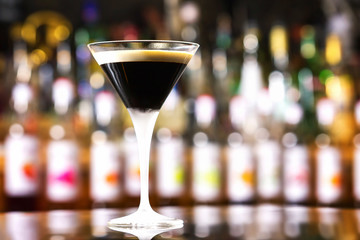 Glass of black russian cocktail at bar counter background. - obrazy, fototapety, plakaty