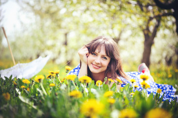 beautiful woman in a cherry orchard