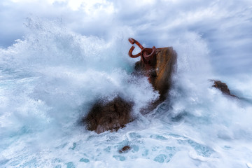 Waves splashing in El peine de los vientos, Chillida's sculpture sited in Donostia, Spain, on March...