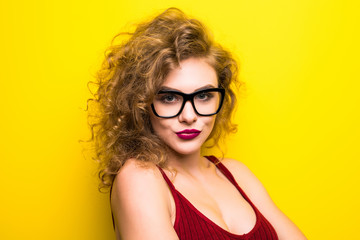 Fototapeta premium Young curly beauty woman posing on yellow background with different gesture.