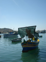 Fototapeta na wymiar Marsaxlokk, Malta boats in harbour