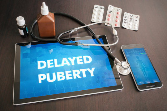 Delayed puberty (endocrine disease) diagnosis medical concept on tablet screen with stethoscope