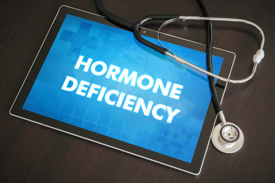 Hormone deficiency (endocrine disease) diagnosis medical concept on tablet screen with stethoscope
