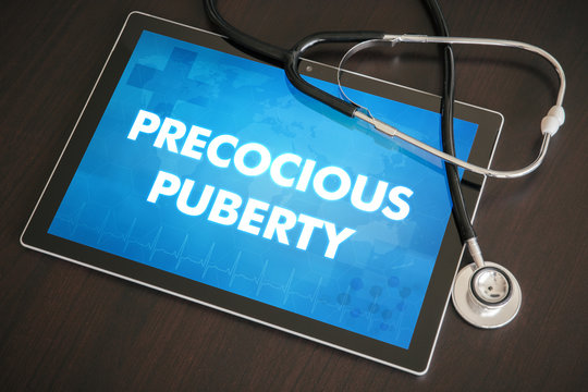 Precocious puberty (endocrine disease related) diagnosis medical concept on tablet screen with stethoscope