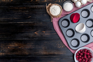 Ingredients for muffin on a dark background