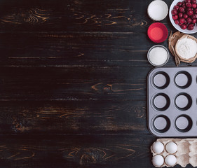 Ingredients for muffin on a dark background