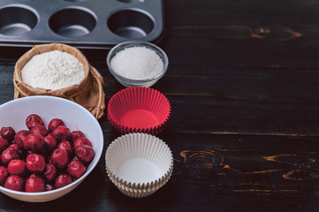 Ingredients for muffin on a dark background