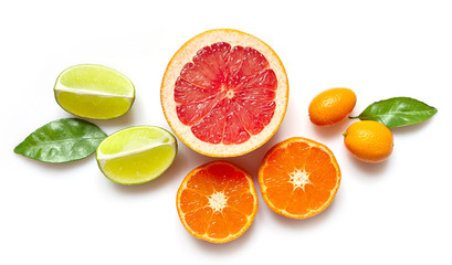 various citrus fruits on white background