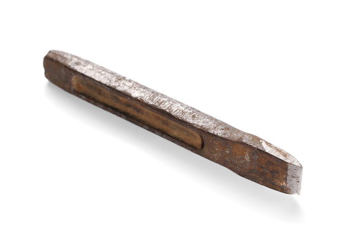 old rusty metal chisel isolated on white background
