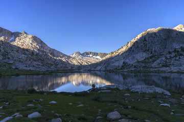 Evolution Light - First morning sunlight pours across Evolution Lake in the Sierra Nevada on the Pacific Crest Trail. 