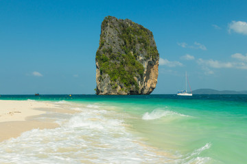 View from Koh Poda (Poda Island) to Ma Tang Ming rock with yacht in Andaman sea, Krabi province,...
