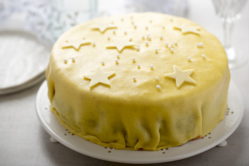Marzipan Christmas Torte with Cherries, whipped hazelnut cream and white star decoration