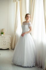 Fototapeta premium Beautiful bride before wedding ceremony in appartament