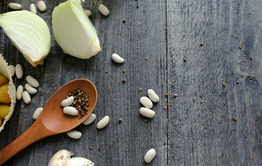 Grey wooden table with vegetables, onions, mushrooms, peppers, asparagus and spices. Process of cooking. Concept food. cooking.