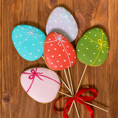 Easter cookies on rustic wooden background. Happy Easter.