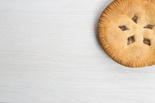 Apple Pie Cake Lying On Wooden White Background