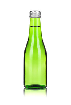Close-up glass bottle with mineral water isolated on white background