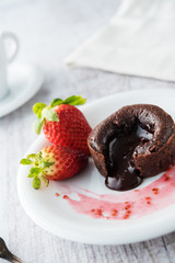 Chocolate souffle with strawberries