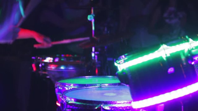 the game on the glowing drums