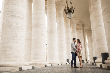 Loving couple at the St. Peter's Square in Vatican