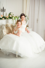 Two beautiful brides in wedding dress