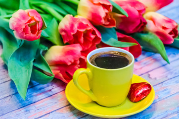 Still life with tulips on the wooden background
