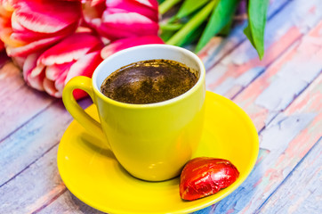 Still life with tulips on the wooden background