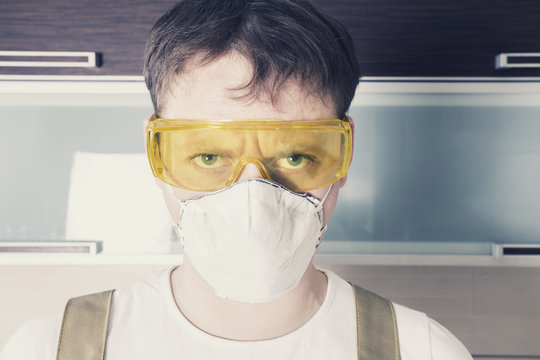 Worker face protected by glasses and mask