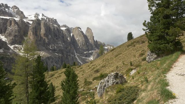 Panning view of the Sella Group mountain peaks as seen from a trail on Pizes de Cir near the Gardena Pass in South Tyrol, Northern Italy.