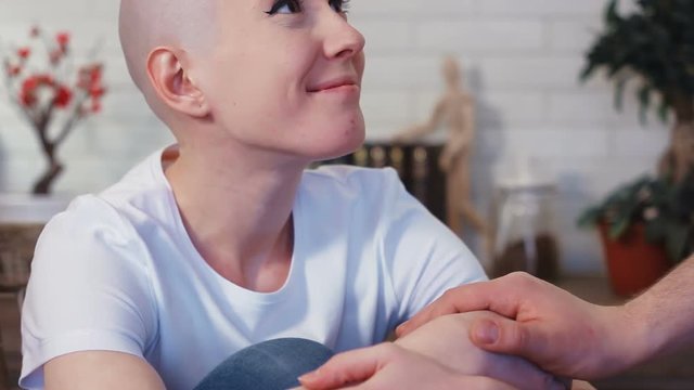 Sad, depressed cancer patient woman is supported by her husband