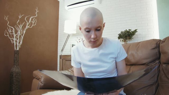 Sad, depressed cancer patient woman reading her diagnosis